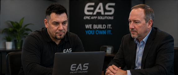 Jade Chancey and Tim Calabro reviewing work on a laptop
