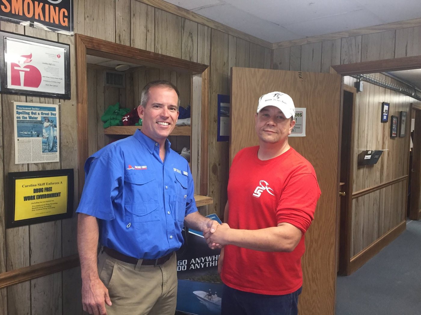Jade Chancey shaking hands with a client at their office