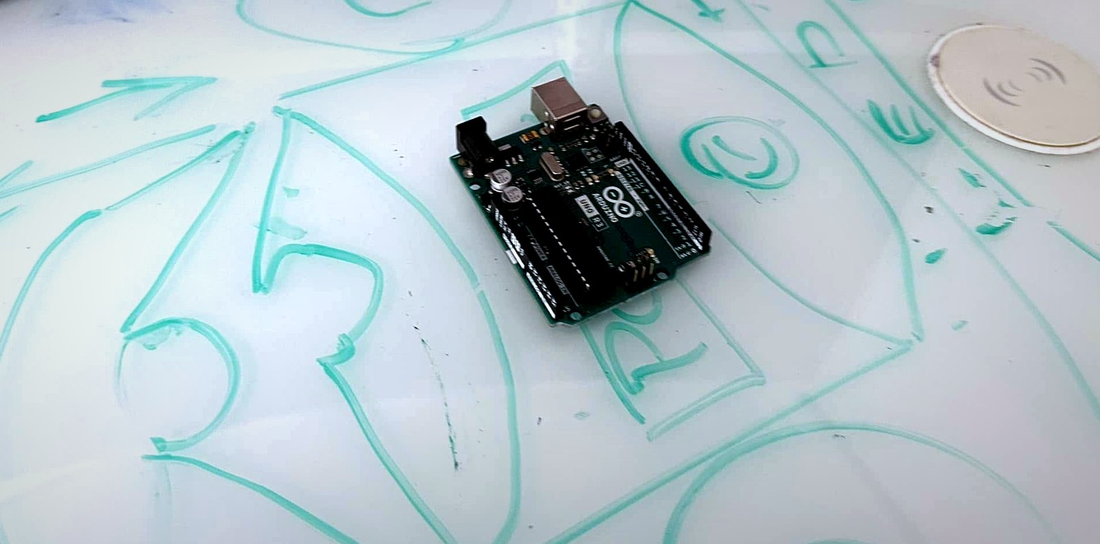 Arduino board, caliper, laser equipment, and system measurements on a working surface