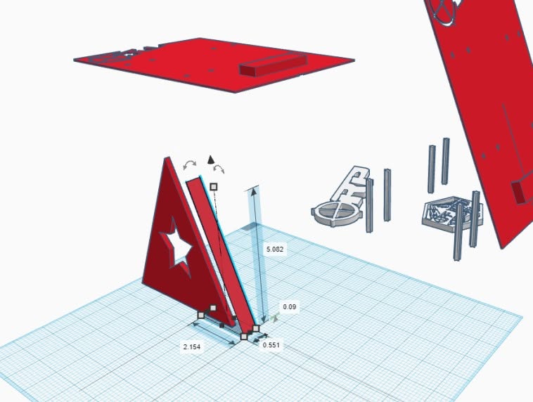 Exploded CAD view showing the separate structural pieces and measured assembly of a red physical prototype
