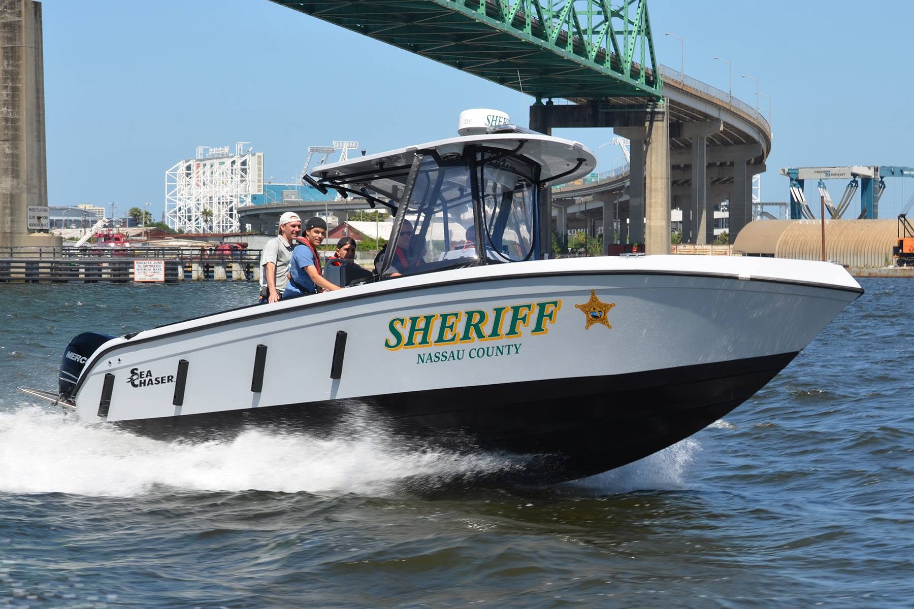 Sea Chaser sheriff patrol boat underway beneath a bridge