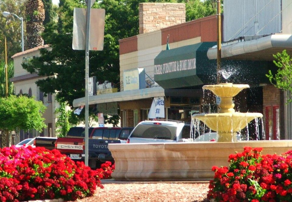 The fountain roundabout in downtown Patterson — cover of WELCOME Patterson, the Patterson California city magazine